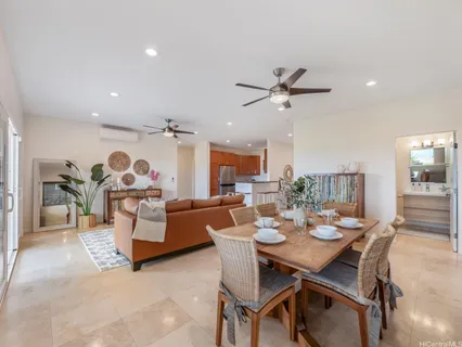 a kitchen with stainless steel appliances granite countertop a sink a stove a refrigerator a microwave and cabinets