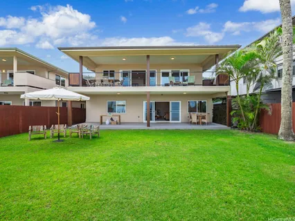 a view of chairs and table in the patio