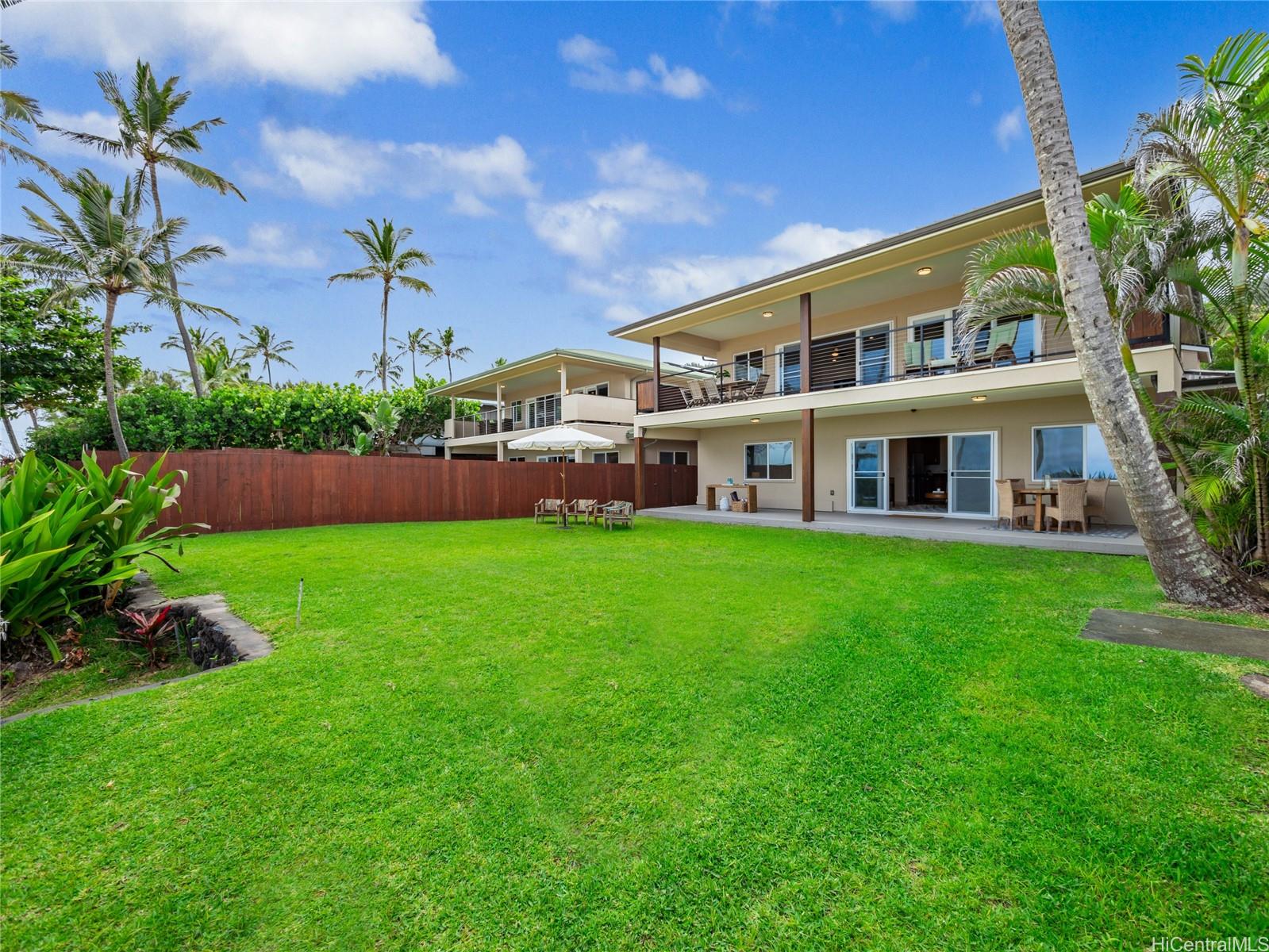 59-355 Ke Nui Road Haleiwa, HI 96712 - Photo 2 of 25 a front view of a house with a garden and yard