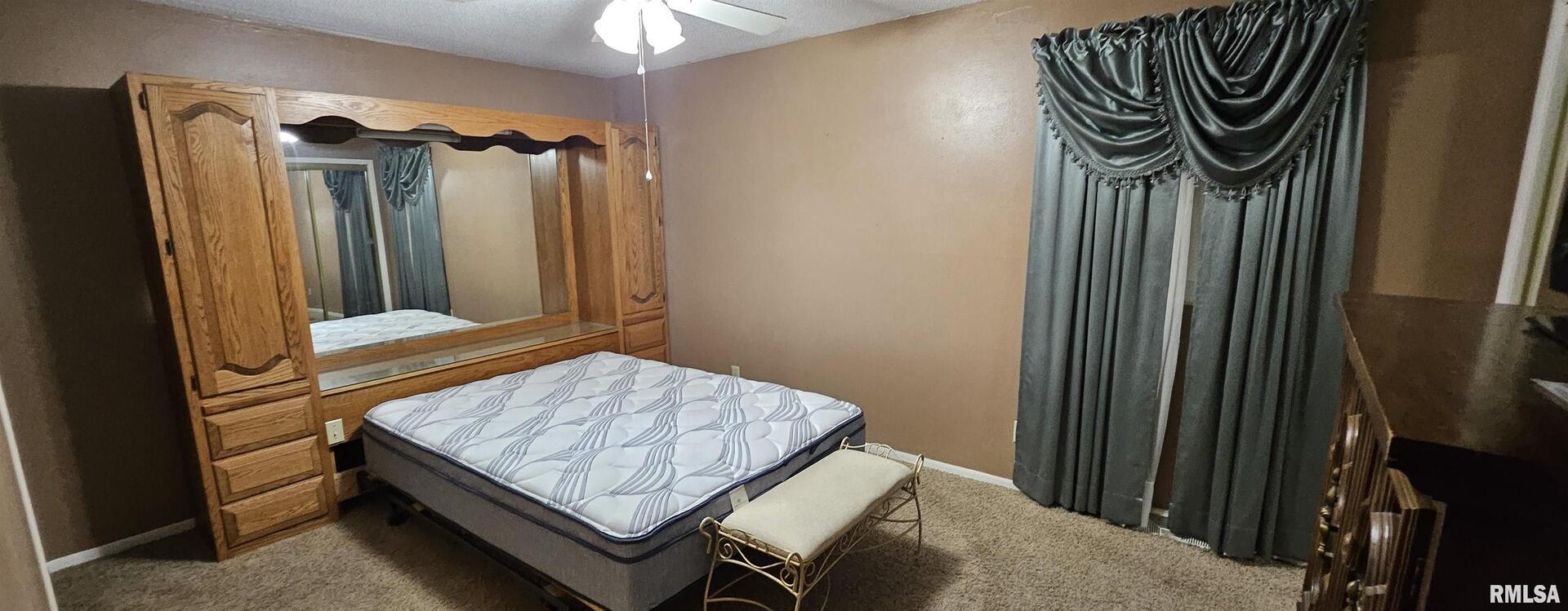 103 David Drive McClure, IL 62957 - Photo 11 of 13 a bedroom with a bed and a mirror