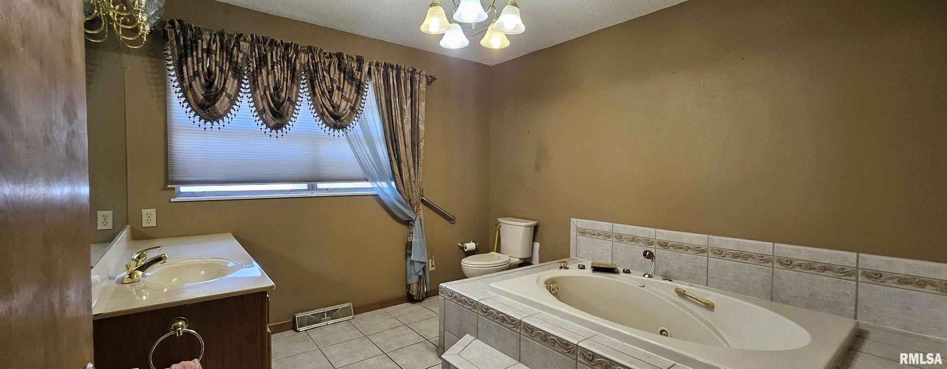 103 David Drive McClure, IL 62957 - Photo 10 of 13 a bathroom with a sink and a mirror