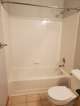 a sink with white cabinets