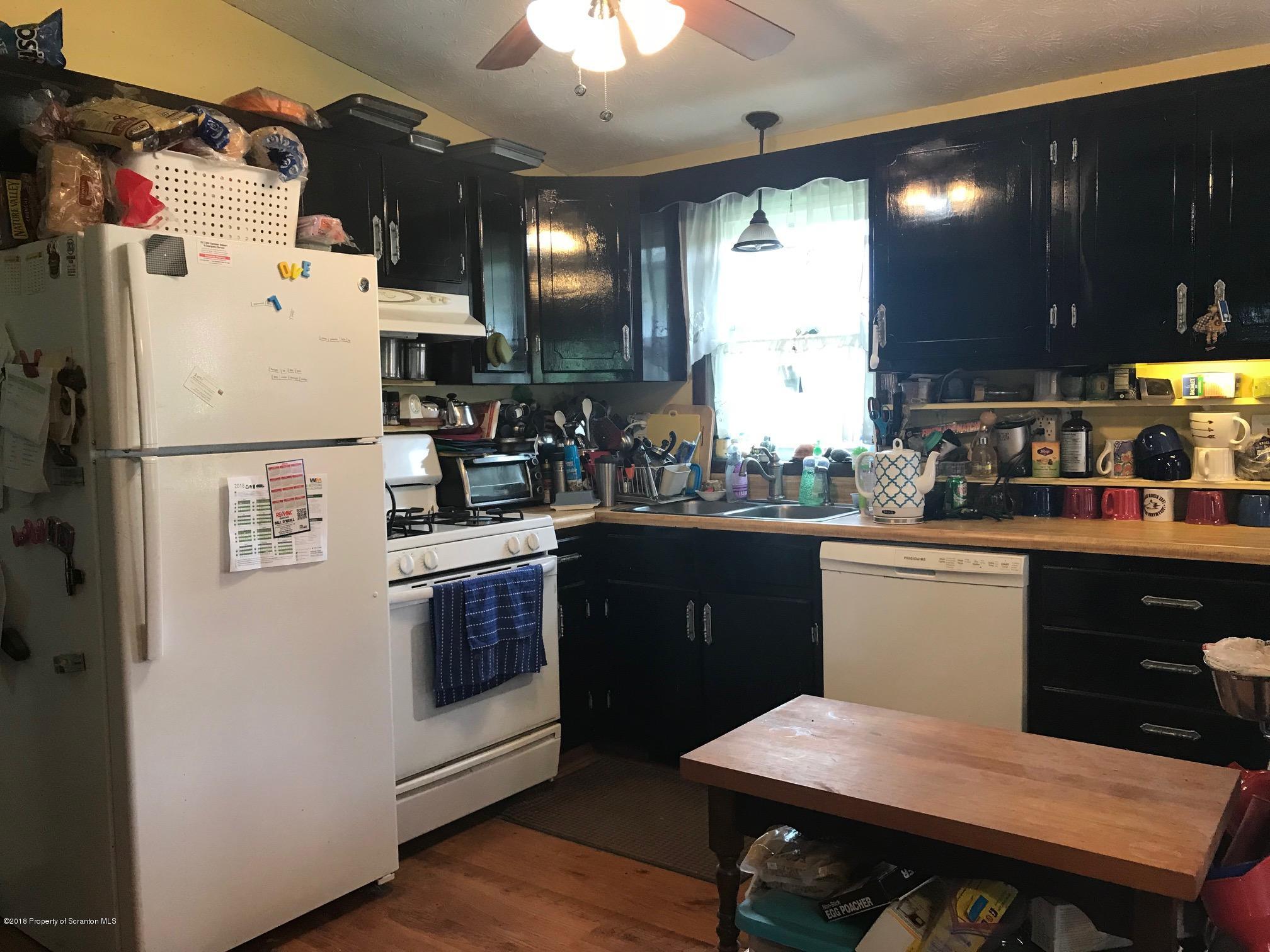 138 Pine Mill Road Honesdale, PA 18431 - Photo 20 of 54 a kitchen with a white refrigerator a sink dishwasher and a stove with wooden floor