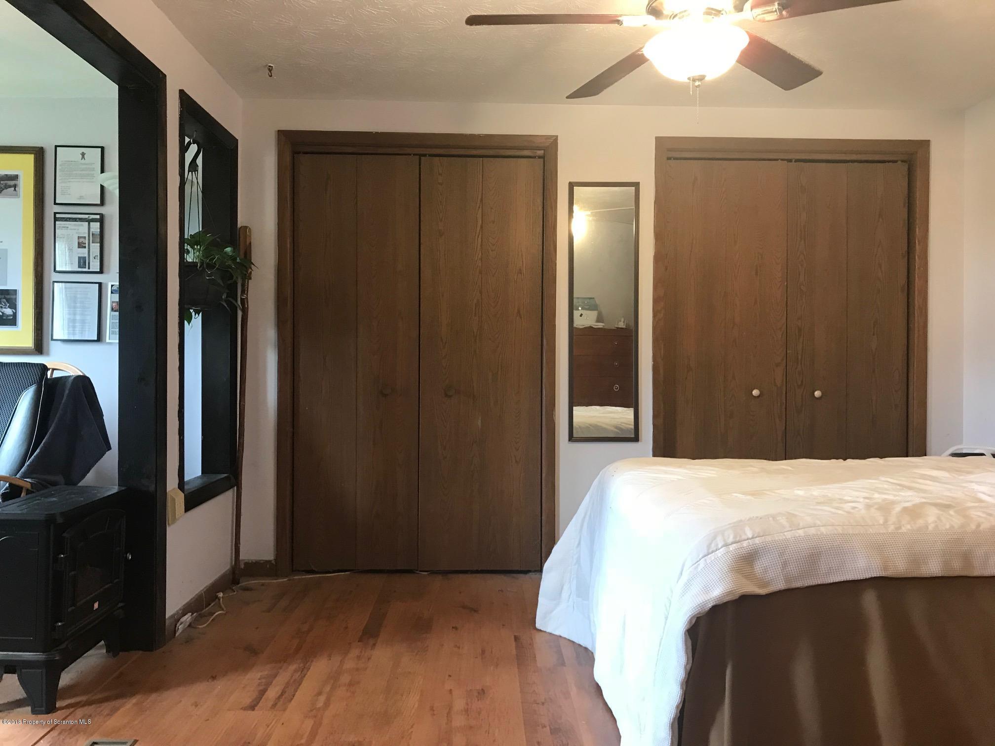 138 Pine Mill Road Honesdale, PA 18431 - Photo 36 of 54 a bedroom with a bed and a mirror