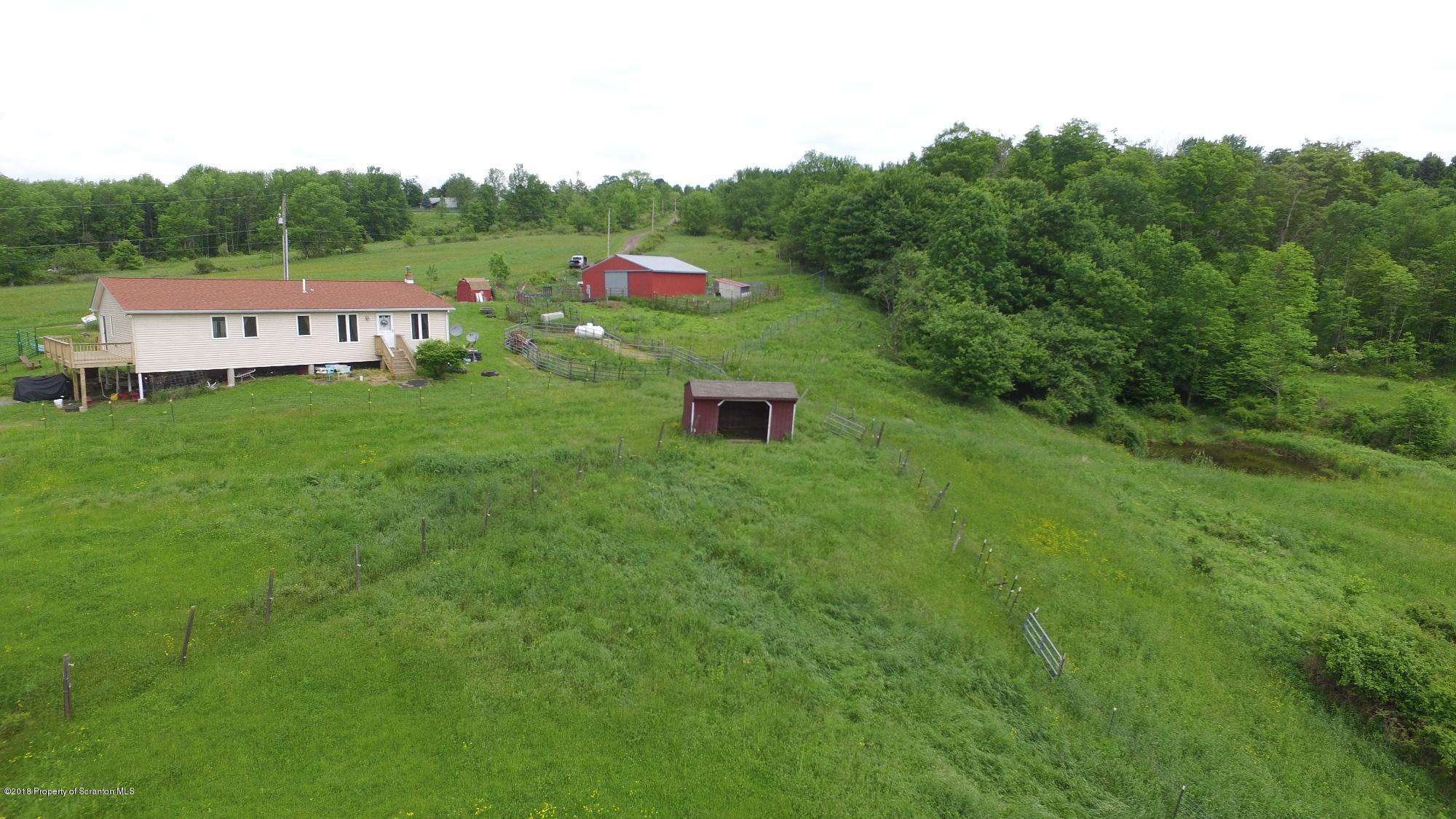138 Pine Mill Road Honesdale, PA 18431 - Photo 4 of 54 a view of a lush green field