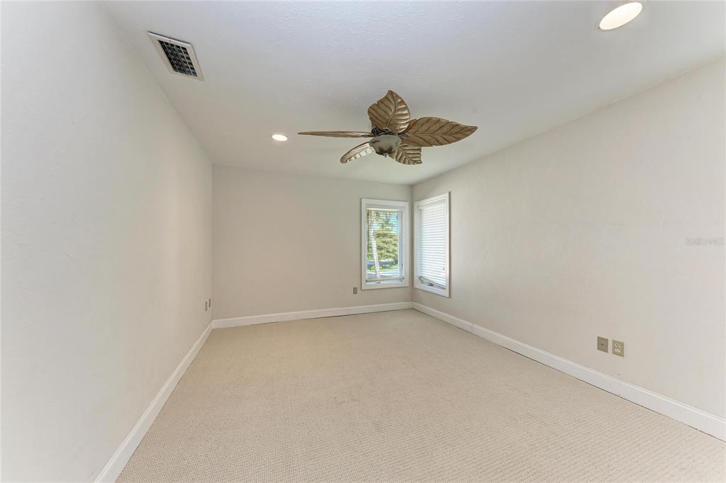 3291 Bayou Road Longboat Key, FL 34228 - Photo 16 of 41 wooden floor in an empty room with a window