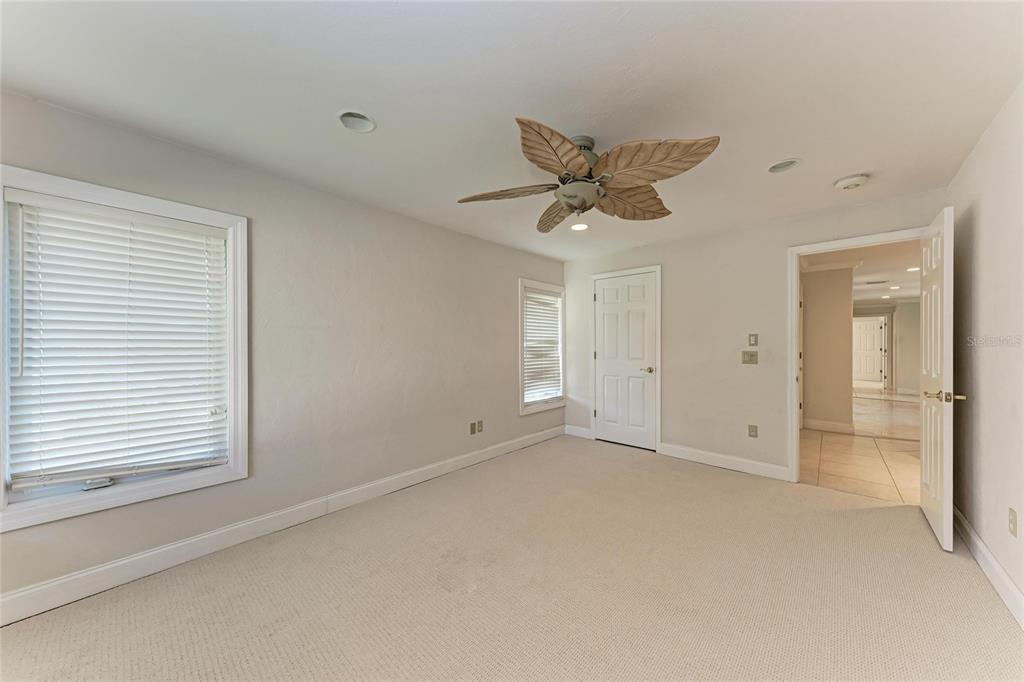 3291 Bayou Road Longboat Key, FL 34228 - Photo 17 of 41 an empty room with a empty space and a ceiling fan