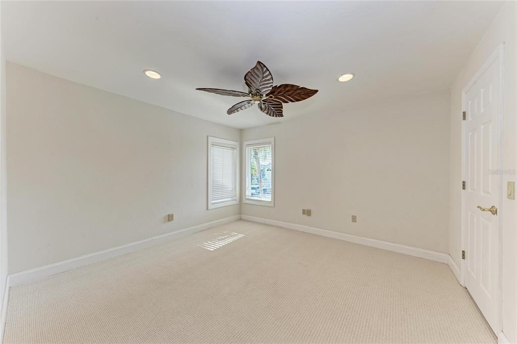 3291 Bayou Road Longboat Key, FL 34228 - Photo 19 of 41 wooden floor in an empty room with a window