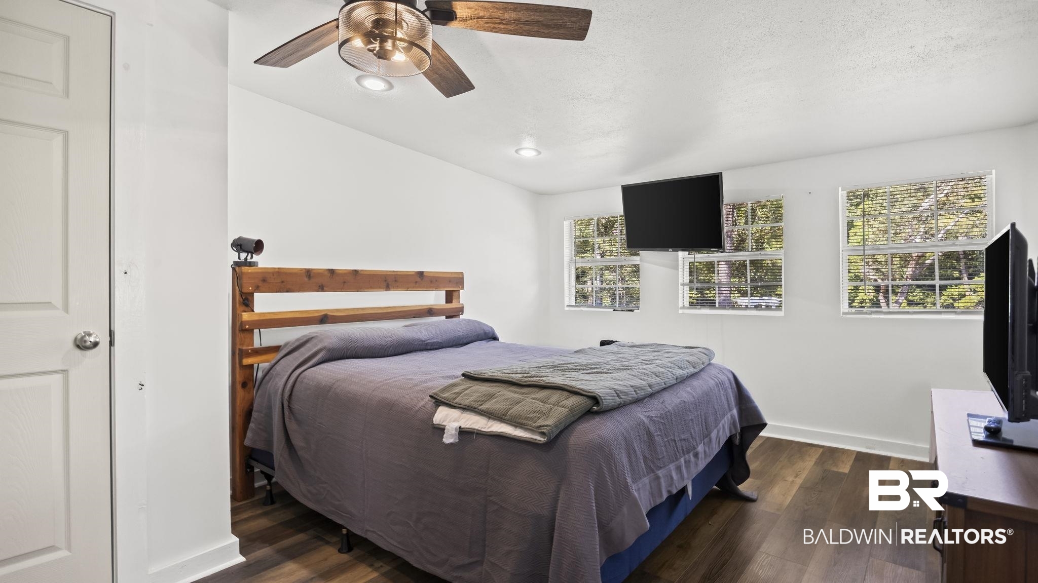12855 Woodhaven Dairy Road West Silverhill, AL 36576 - Photo 18 of 27 Bedroom featuring dark wood-style flooring, ceiling fan, recessed lighting, and lofted ceiling