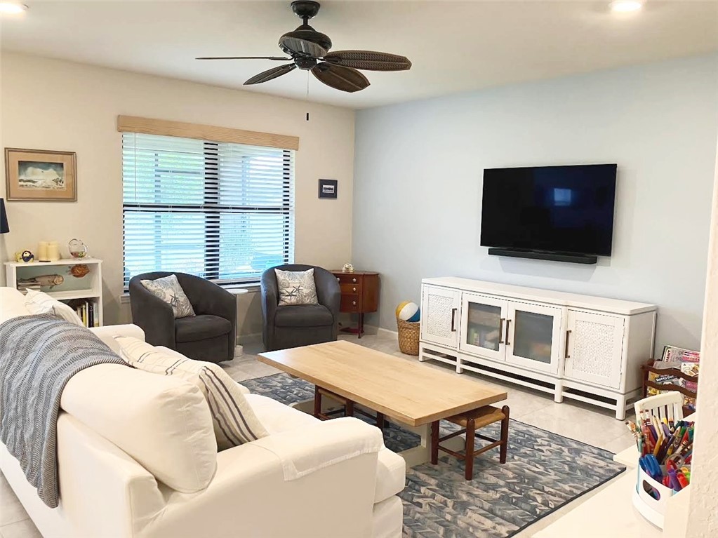 Undisclosed Address Vero Beach, FL 32967 - Photo 4 of 7 a living room with furniture and a flat screen tv