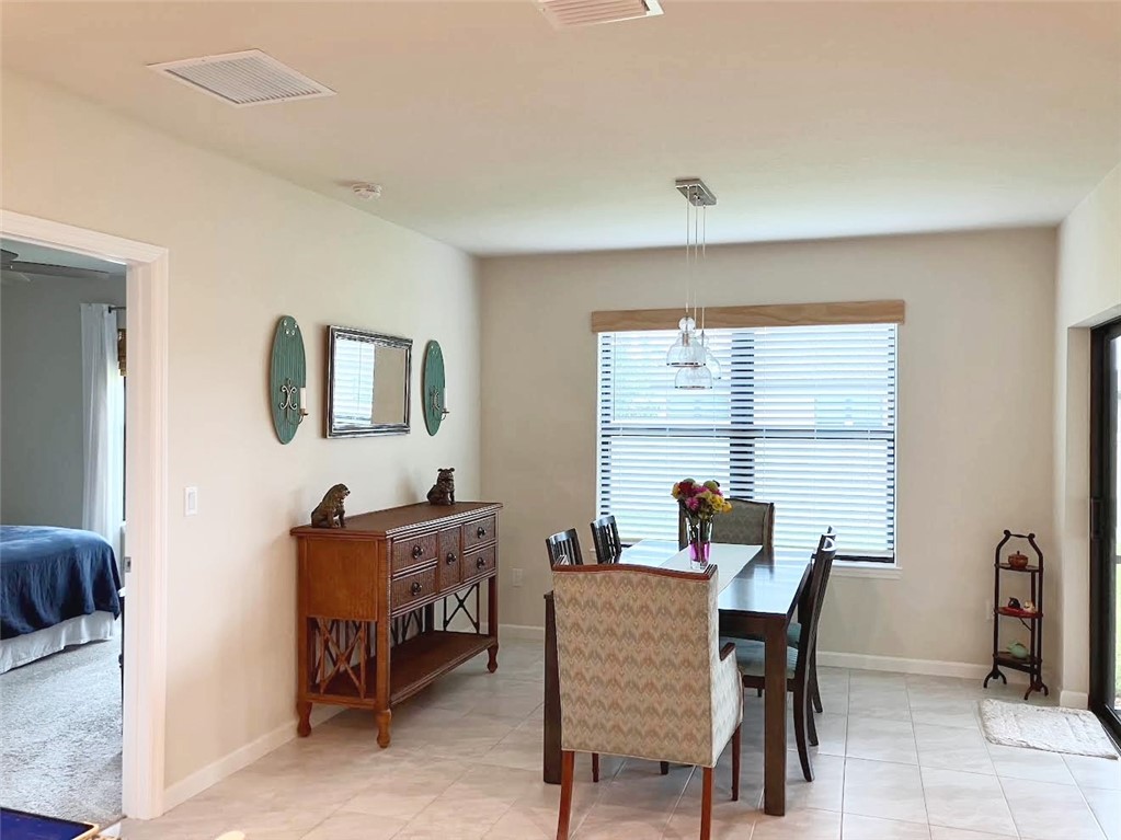Undisclosed Address Vero Beach, FL 32967 - Photo 5 of 7 a dining room with furniture and window
