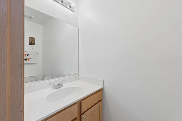 a kitchen with granite countertop a refrigerator stove top oven a sink and dishwasher