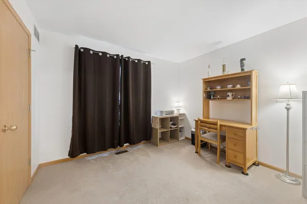 a view of an empty room with storage