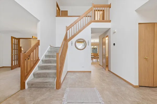 a view of an entryway with stairs