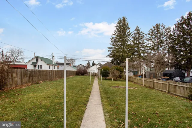 a picture of a bench in front of a window