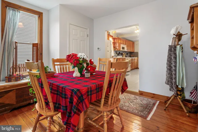 a view of a dining room with furniture and chandelier