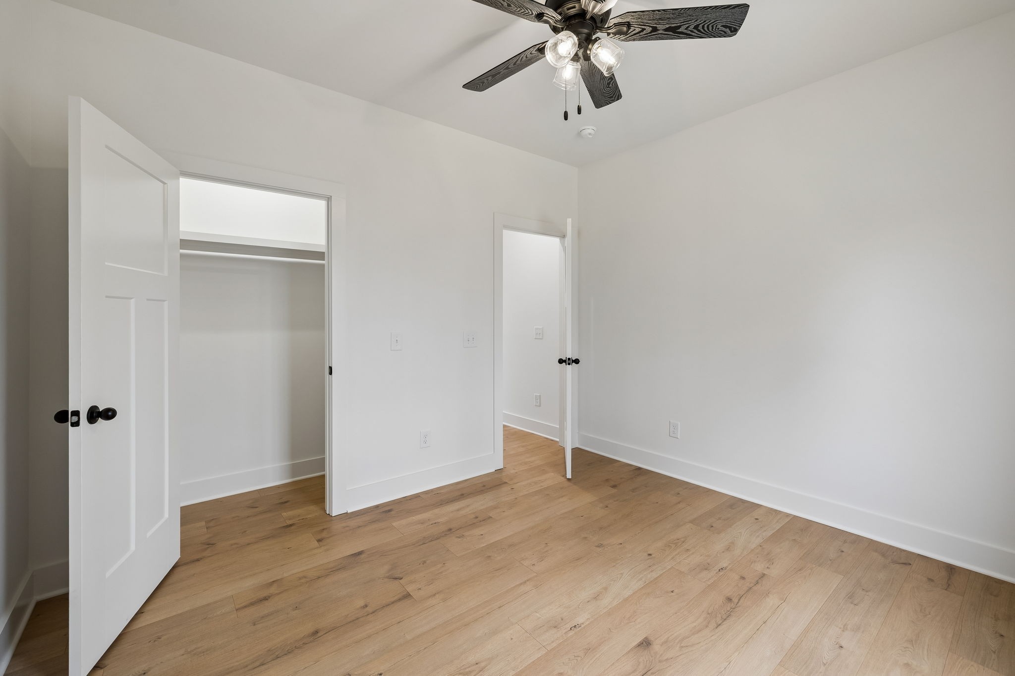 4083 Long Creek Road Lafayette, TN 37083 - Photo 21 of 36 an empty room with a hardwood and ceiling fan