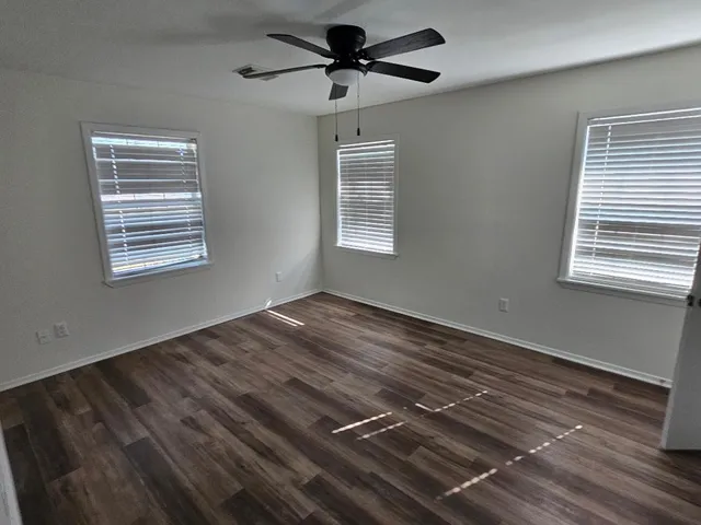 a view of a livingroom with wooden floor