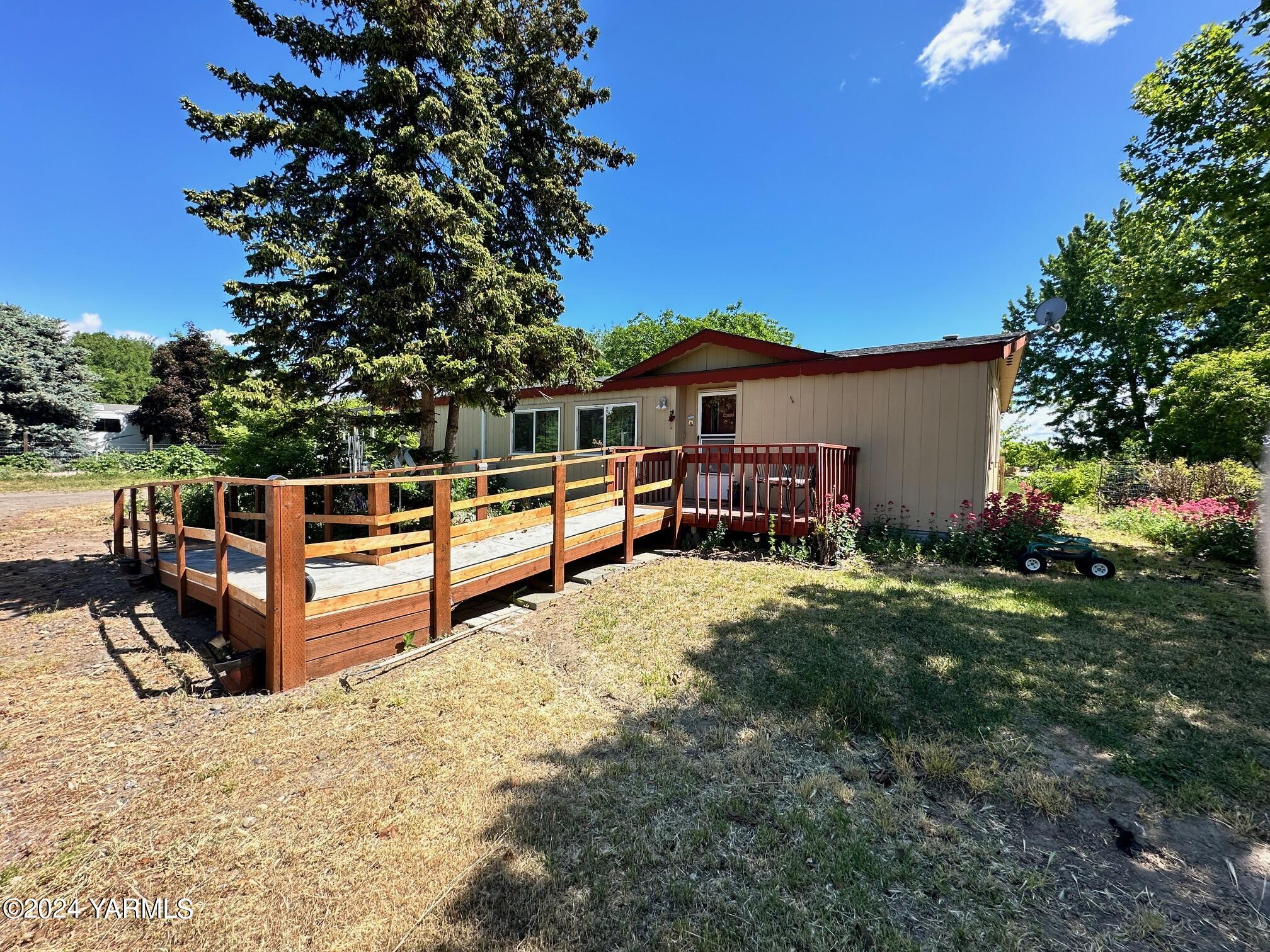 a view of house with outdoor seating