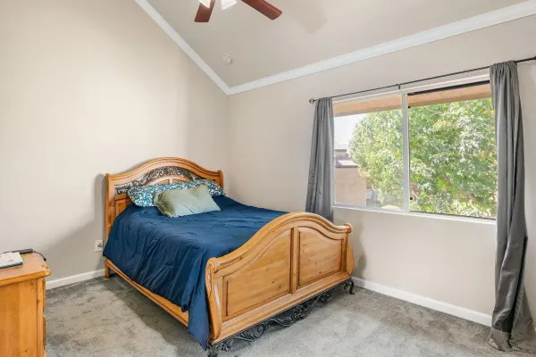 a bedroom with a bed and window
