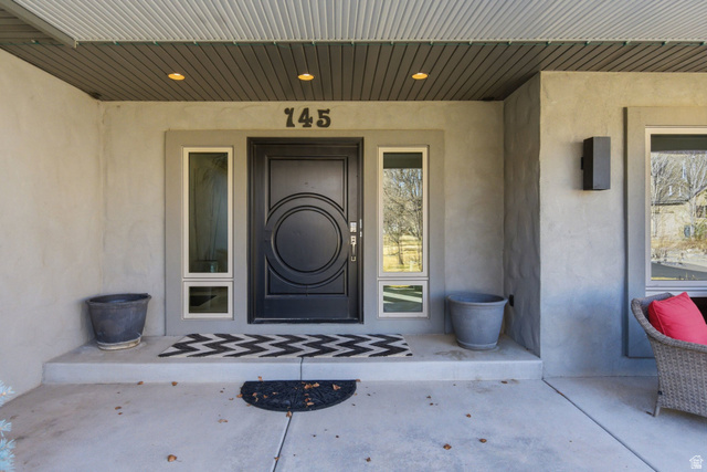 145 Carnesecca Court Mapleton, UT 84664 - Photo 4 of 109 Property entrance featuring stucco siding and a porch