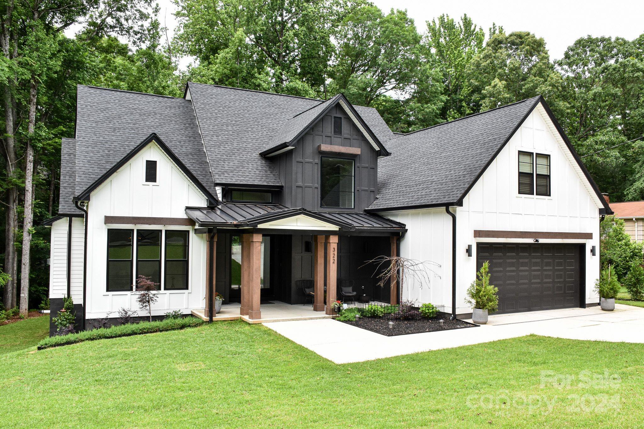 322 Mountainview Drive Charlotte, NC 28270 - Photo 1 of 47 a front view of a house with a yard