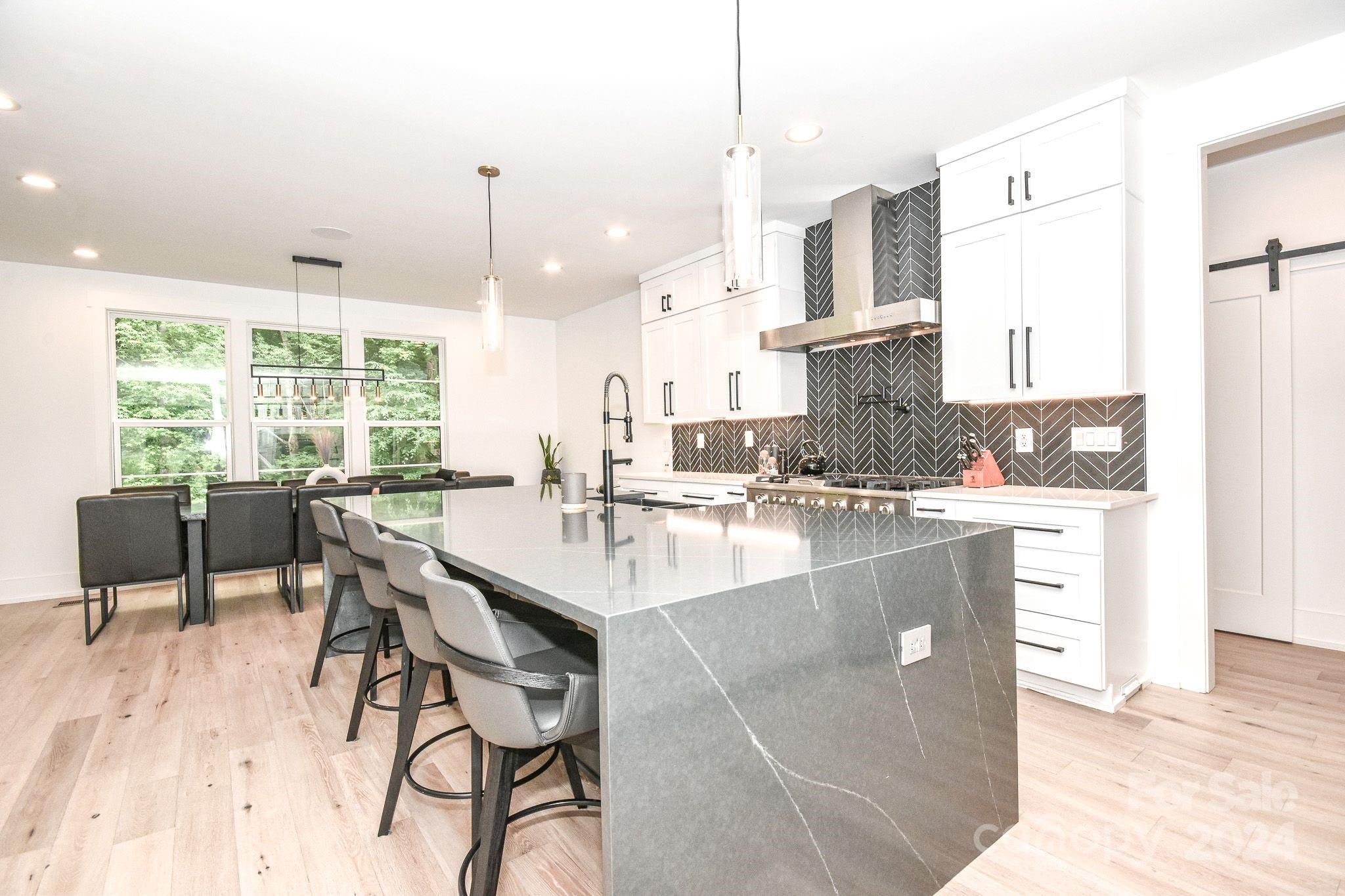 322 Mountainview Drive Charlotte, NC 28270 - Photo 11 of 47 a large kitchen with kitchen island a large counter top space and appliances