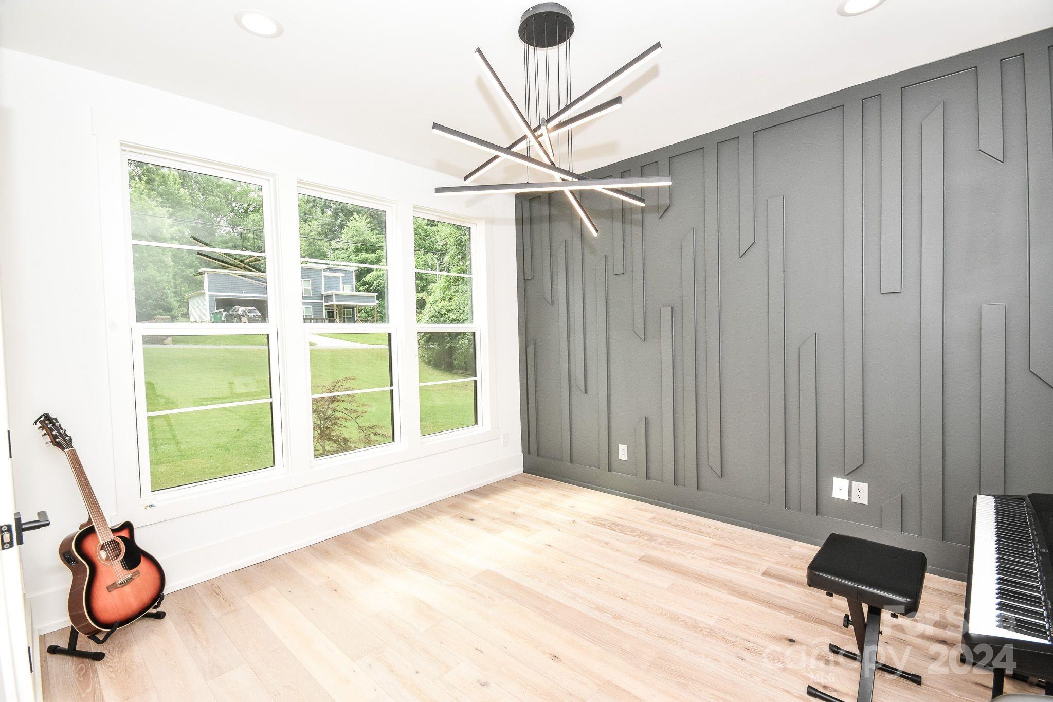 322 Mountainview Drive Charlotte, NC 28270 - Photo 15 of 47 a view of a room with gym equipment and a large window