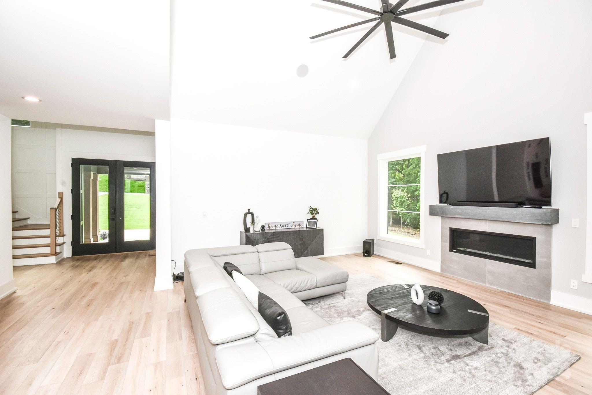 322 Mountainview Drive Charlotte, NC 28270 - Photo 17 of 47 a living room with furniture a flat screen tv and a fireplace