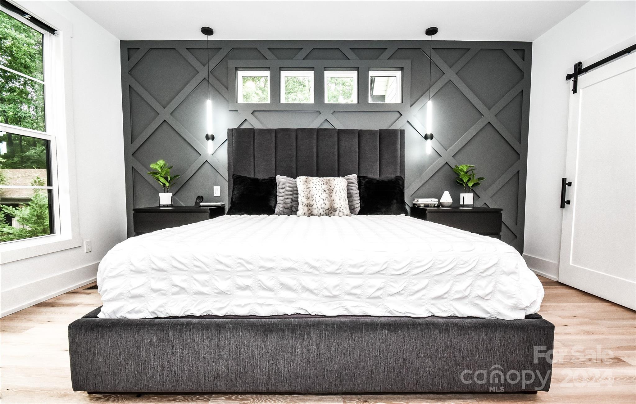 322 Mountainview Drive Charlotte, NC 28270 - Photo 23 of 47 a bed sitting in a bedroom next to a window