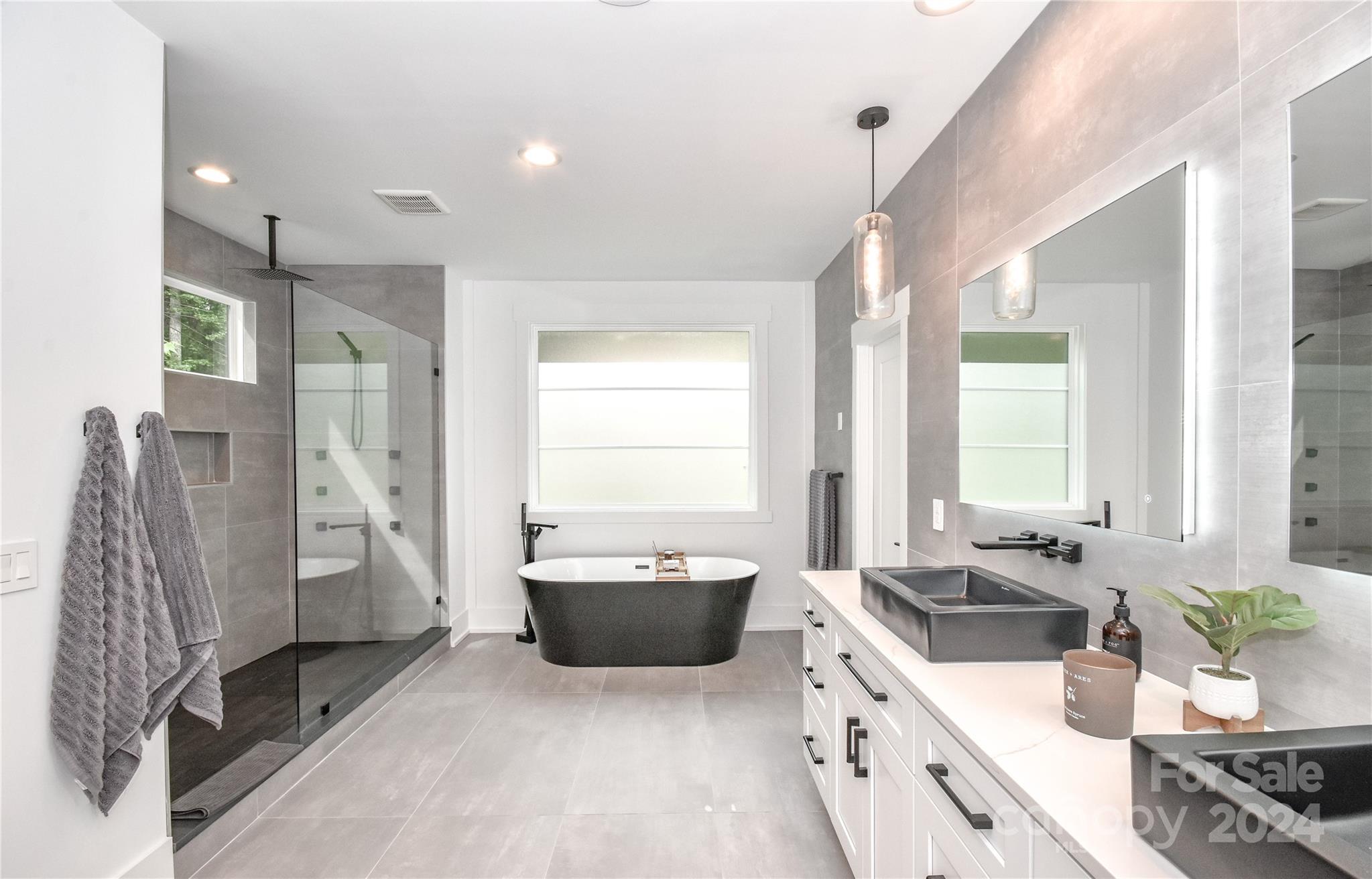 322 Mountainview Drive Charlotte, NC 28270 - Photo 25 of 47 a kitchen with stainless steel appliances a sink a stove a refrigerator and white cabinets