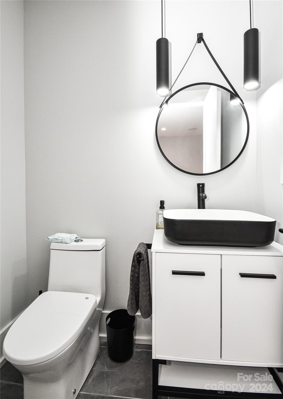 322 Mountainview Drive Charlotte, NC 28270 - Photo 29 of 47 a bathroom with a sink mirror and toilet