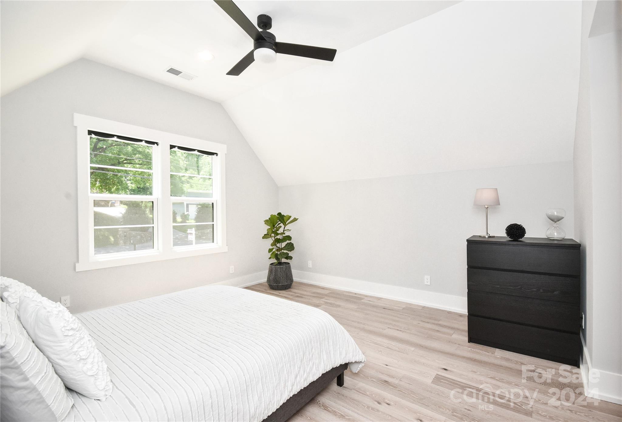 322 Mountainview Drive Charlotte, NC 28270 - Photo 33 of 47 a bedroom with a bed window and a mirror