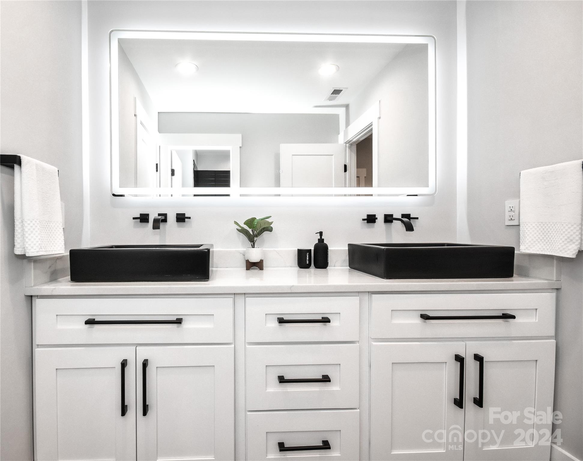 322 Mountainview Drive Charlotte, NC 28270 - Photo 39 of 47 a bathroom with a sink vanity and mirror