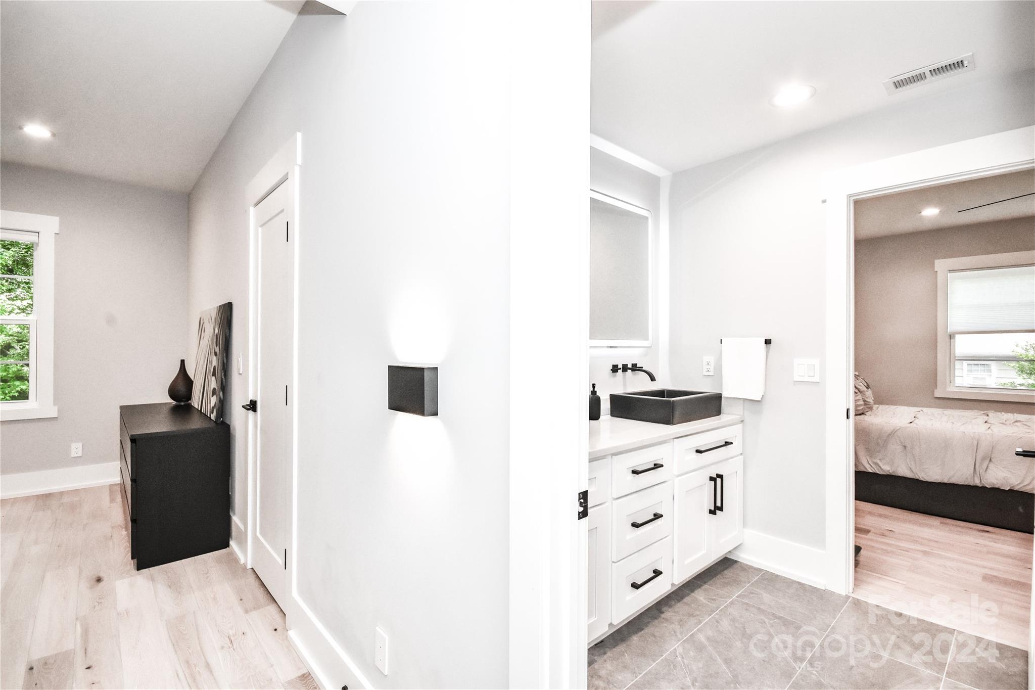 322 Mountainview Drive Charlotte, NC 28270 - Photo 42 of 47 a kitchen with cabinets and wooden floor