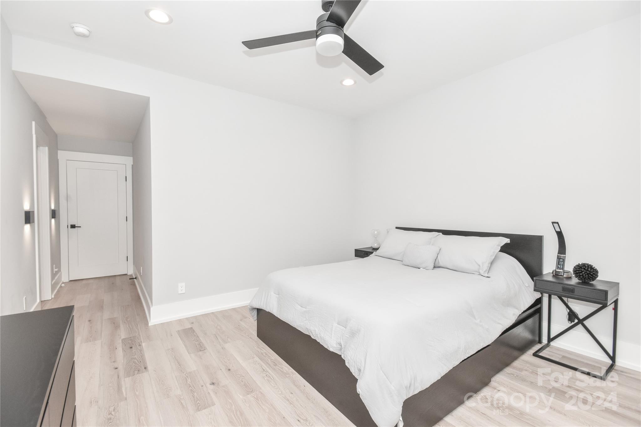 322 Mountainview Drive Charlotte, NC 28270 - Photo 44 of 47 a large bedroom with a bed and a table