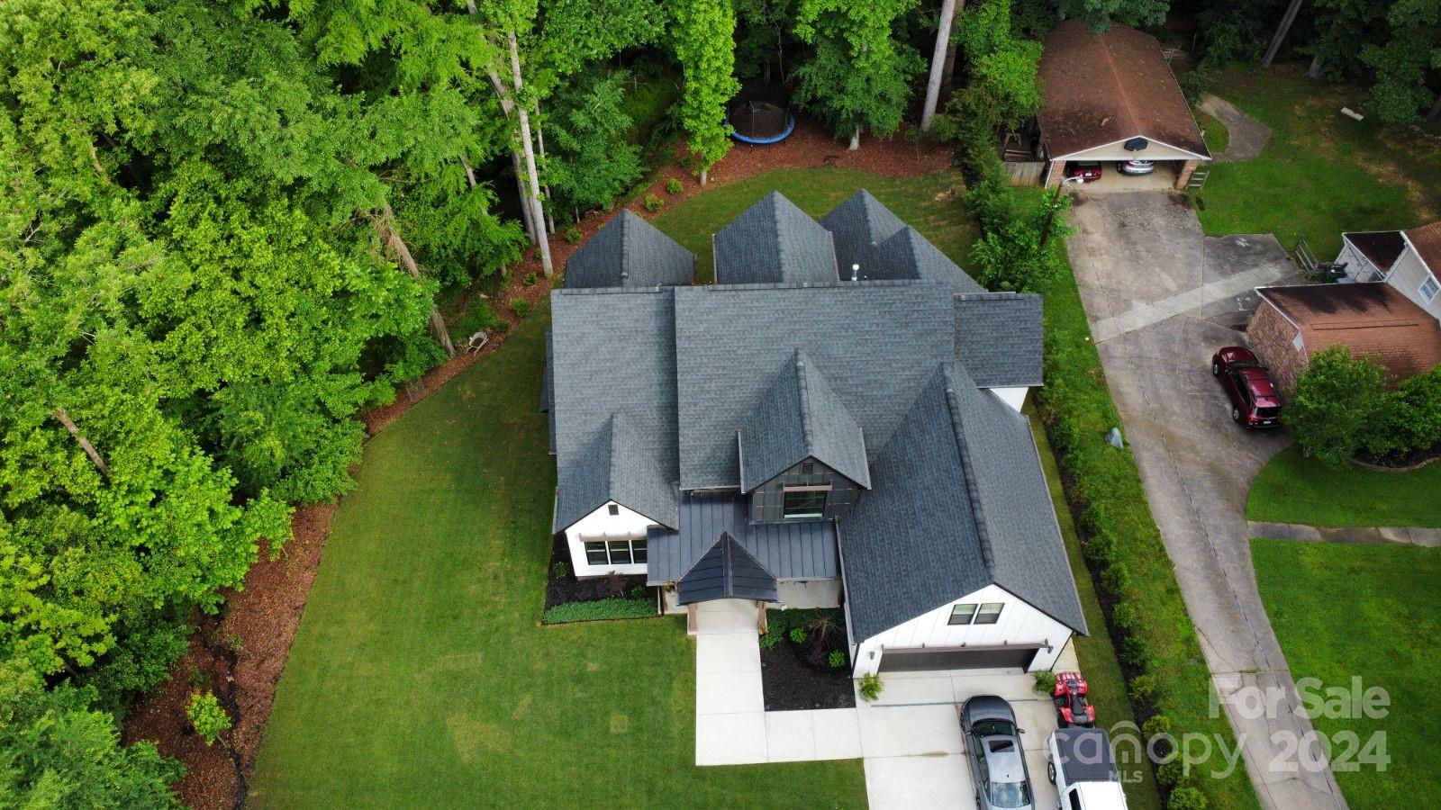 322 Mountainview Drive Charlotte, NC 28270 - Photo 5 of 47 an aerial view of a house with outdoor space and a lake view