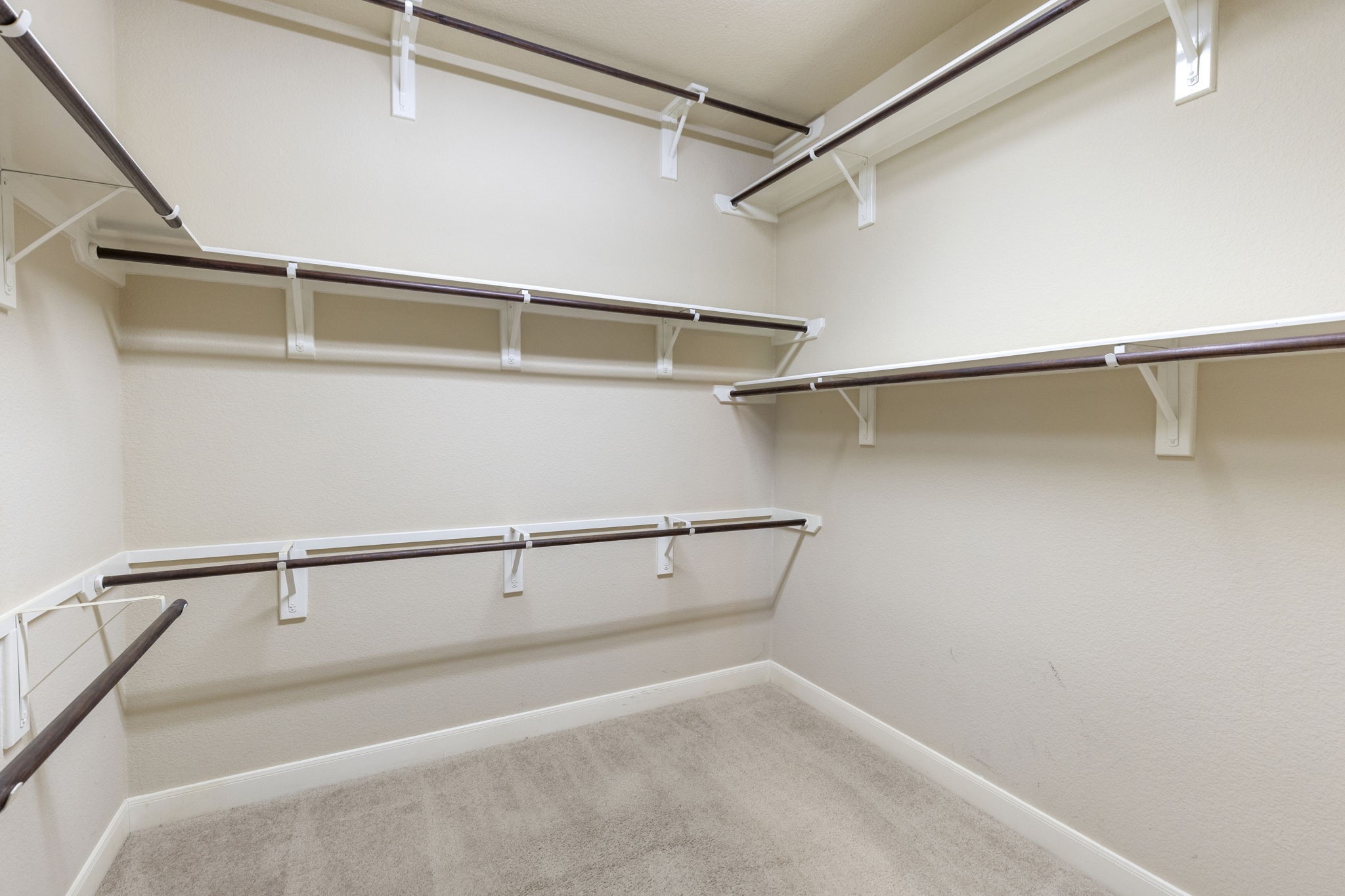 19222 Senterra Lakes Boulevard Spring, TX 77379 - Photo 21 of 45 Incredible primary walk-in closet with wrap-around, multi-level built-in shelving and exceptional storage capacity. This is the second closet in the primary ensuite bathroom.