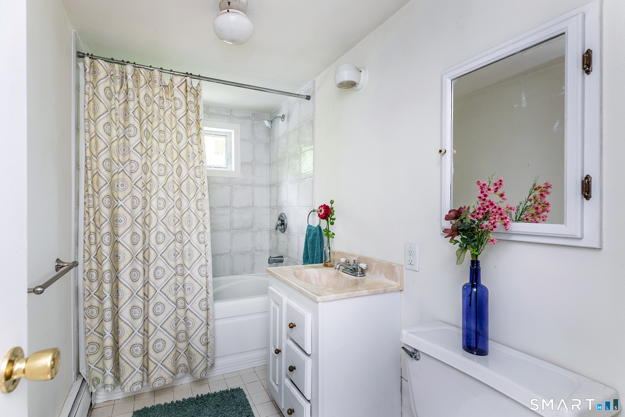 25 Bald Hill Road Kent, CT 06785 - Photo 21 of 38 The second-floor full bathroom conveniently services two additional bedrooms, both featuring beautiful wide wood floors that continue the home's rustic charm.