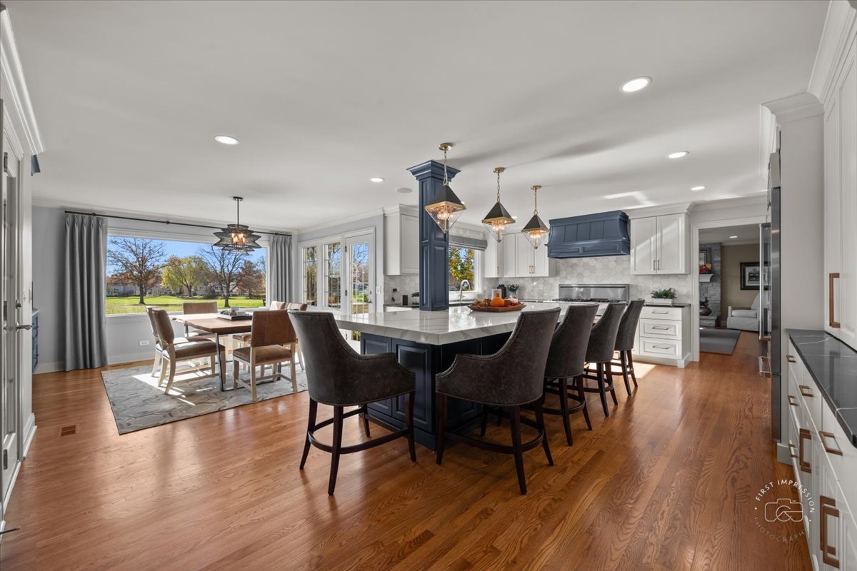 958 West Bauer Road Naperville, IL 60563 - Photo 11 of 57 a view of a dining room with furniture window and wooden floor