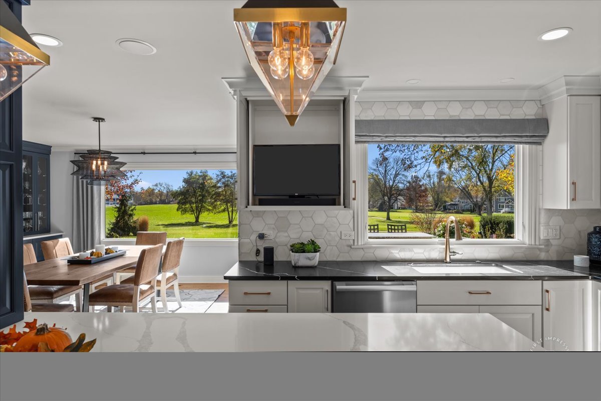 958 West Bauer Road Naperville, IL 60563 - Photo 14 of 57 a kitchen with a stove a sink and a microwave