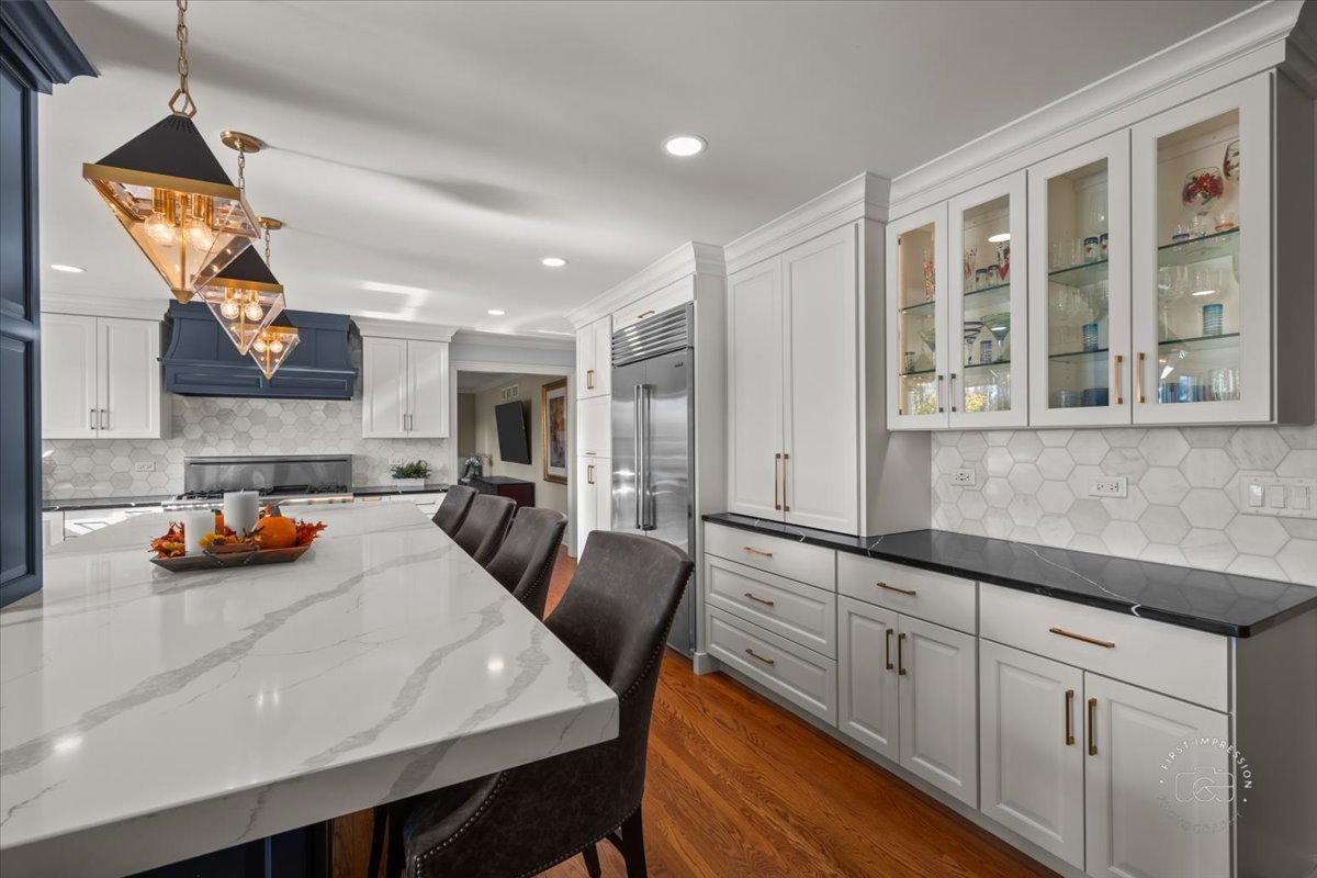 958 West Bauer Road Naperville, IL 60563 - Photo 17 of 57 a kitchen with stainless steel appliances granite countertop a sink a stove and a refrigerator