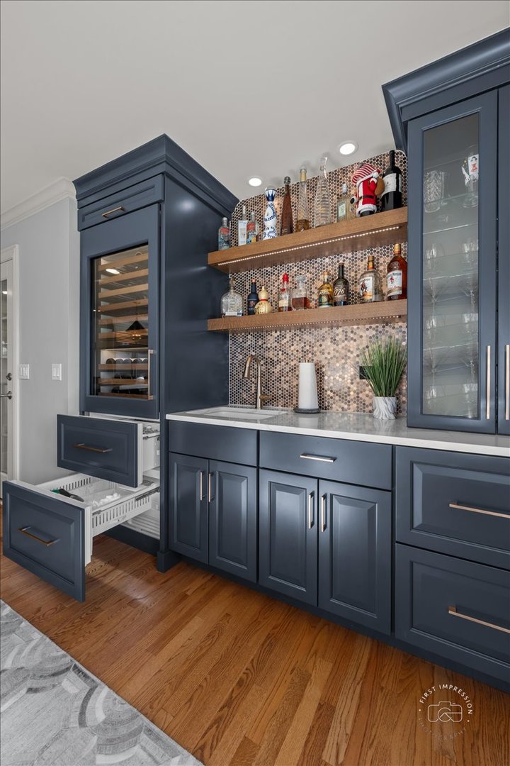 958 West Bauer Road Naperville, IL 60563 - Photo 22 of 57 a kitchen with granite countertop wooden cabinets and a wooden floor