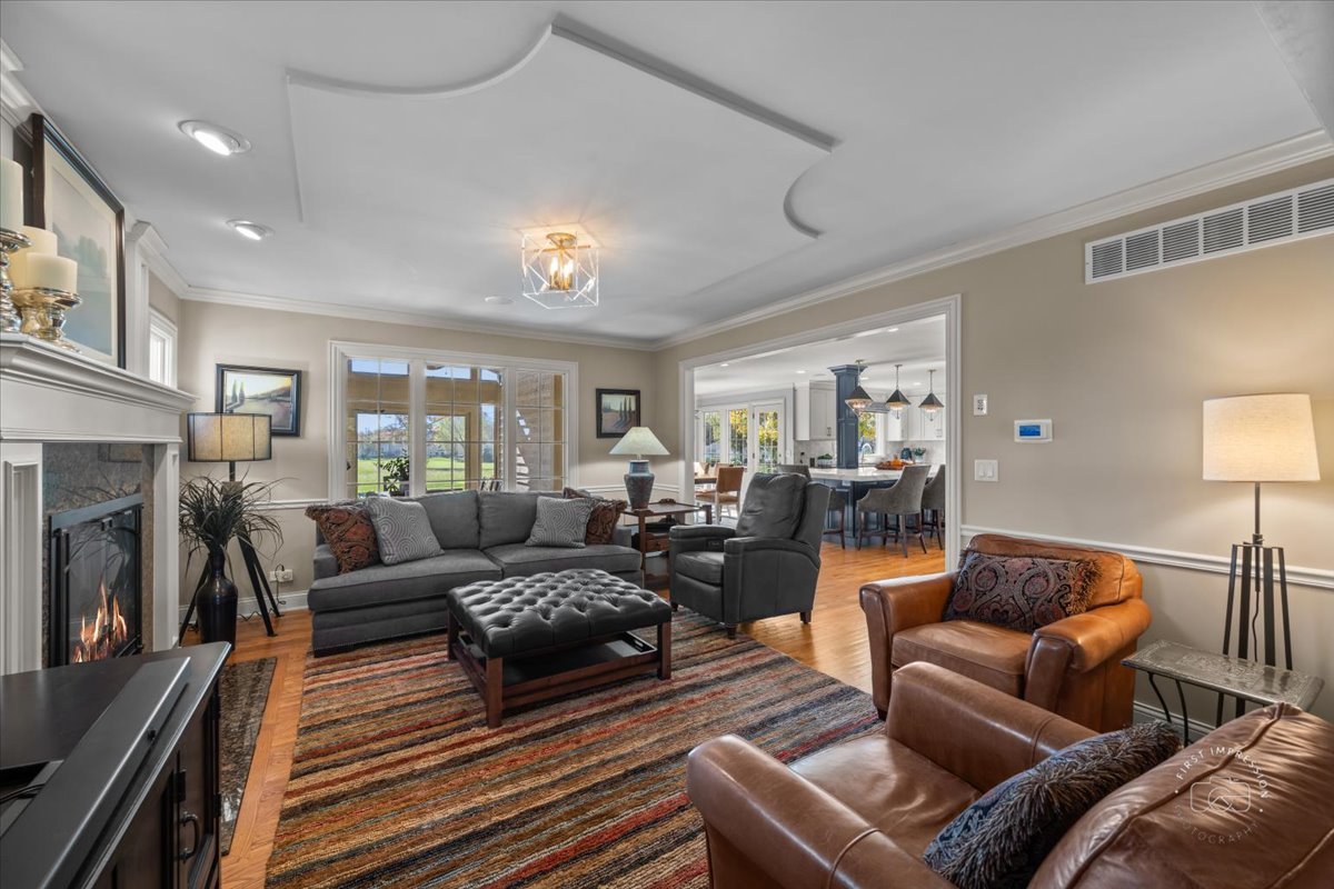 958 West Bauer Road Naperville, IL 60563 - Photo 27 of 57 a living room with furniture and a fireplace