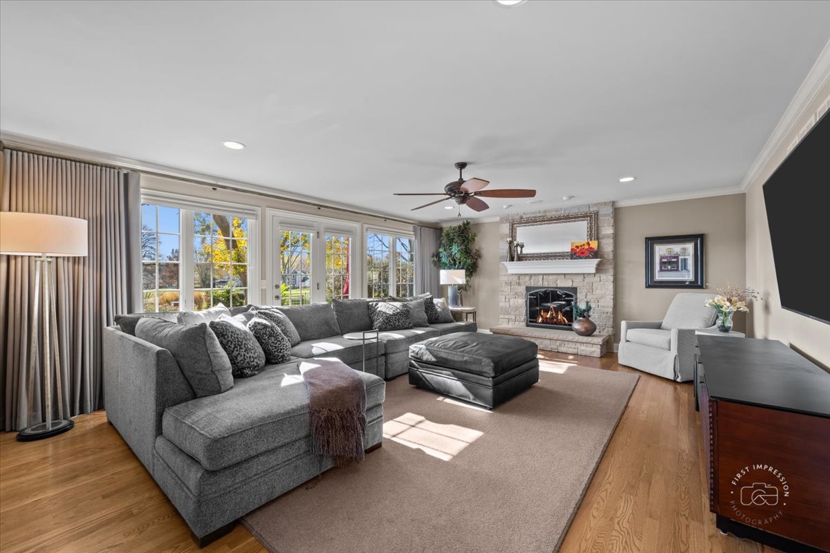 958 West Bauer Road Naperville, IL 60563 - Photo 28 of 57 a living room with furniture fireplace and a flat screen tv