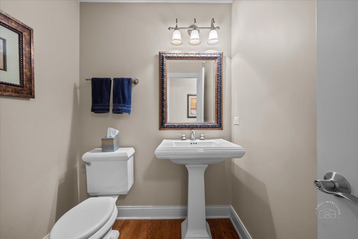 958 West Bauer Road Naperville, IL 60563 - Photo 31 of 57 a bathroom with a toilet sink and mirror