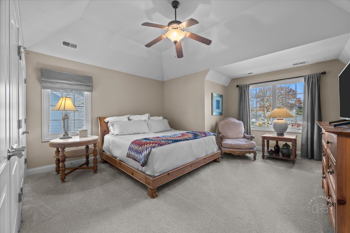 958 West Bauer Road Naperville, IL 60563 - Photo 41 of 57 a spacious bedroom with a bed and a chandelier
