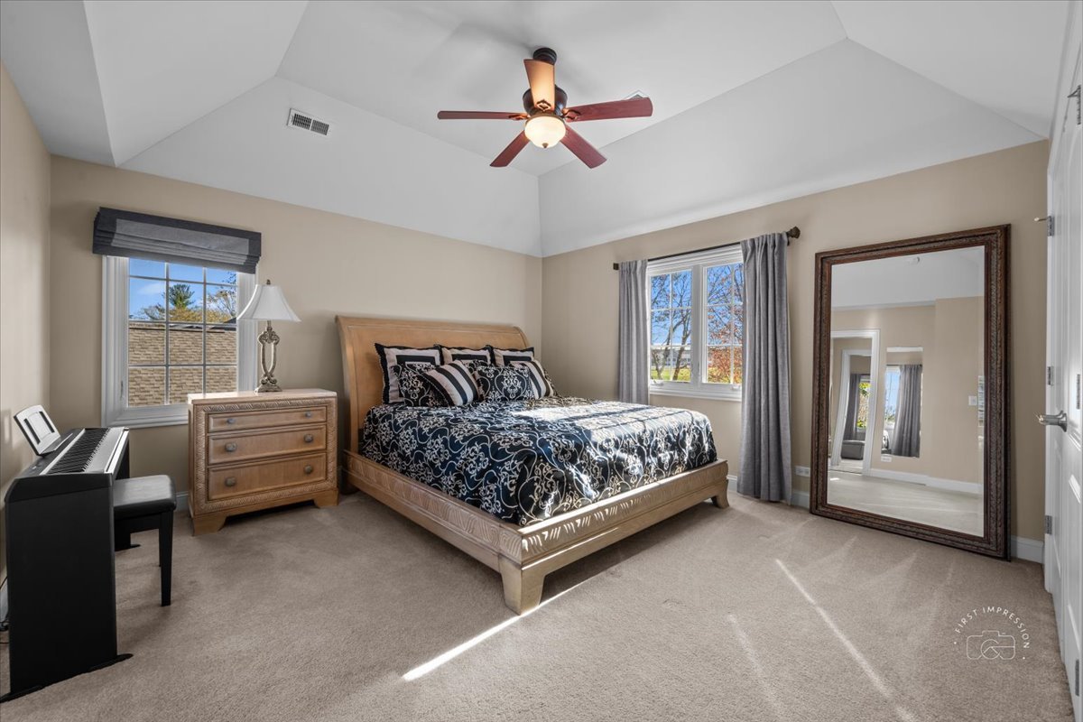 958 West Bauer Road Naperville, IL 60563 - Photo 46 of 57 a bedroom with a bed and a chandelier