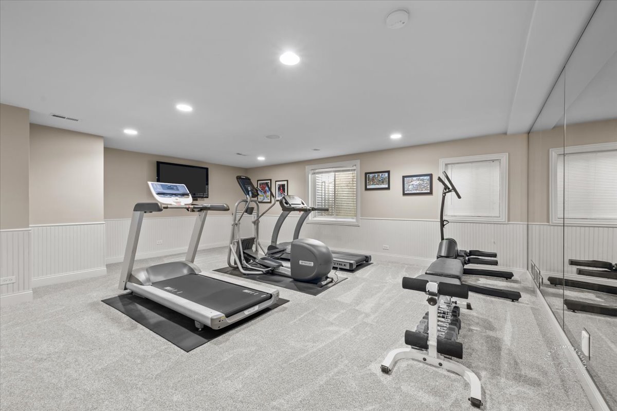 958 West Bauer Road Naperville, IL 60563 - Photo 47 of 57 a room with gym equipment and windows