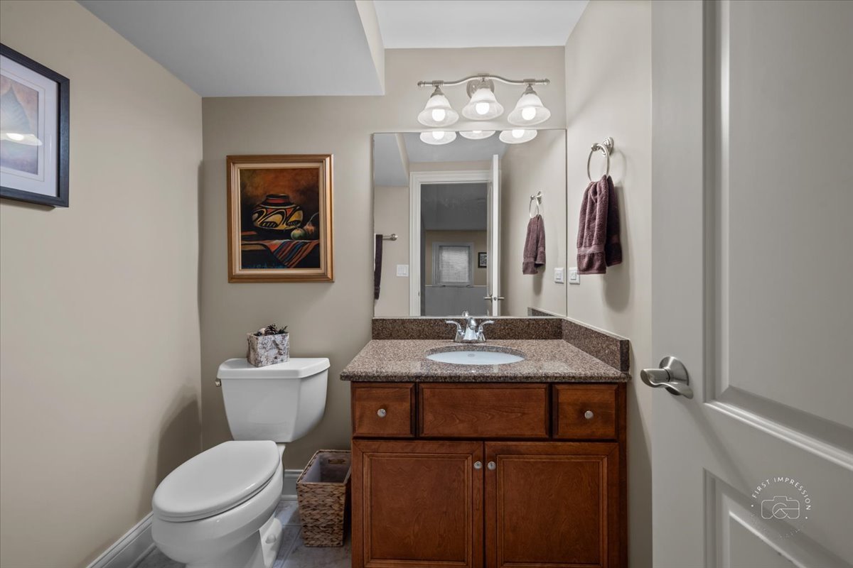 958 West Bauer Road Naperville, IL 60563 - Photo 48 of 57 a bathroom with a granite countertop toilet sink and mirror